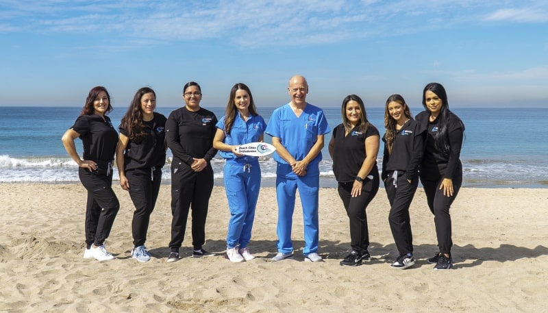 Beach Cities Orthodontics team on beach