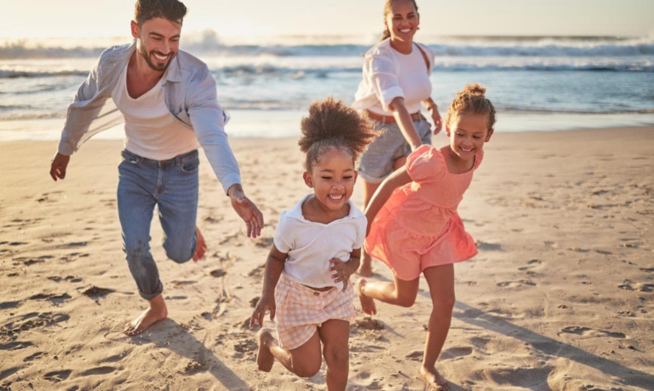 Family running on beach